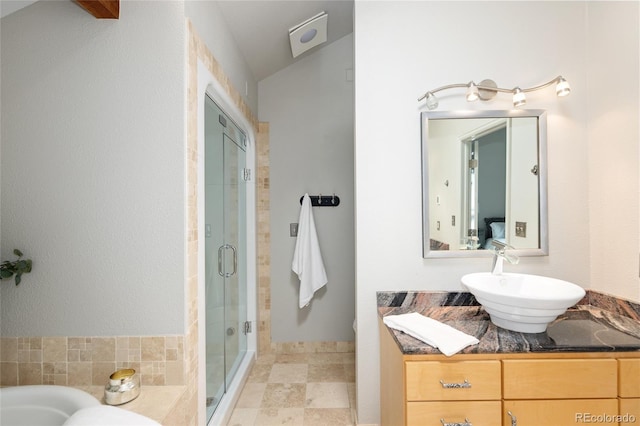 10572 E Orchard Pl, Englewood, CO 80111 - bathroom featuring a shower stall, vanity, and a bath