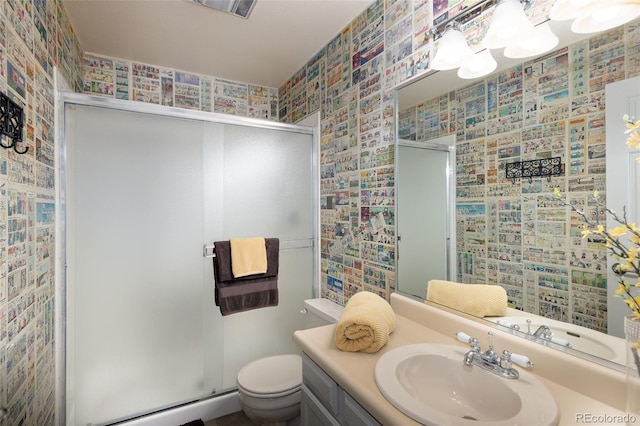 10572 E Orchard Pl, Englewood, CO 80111 - full bathroom with a shower stall, vanity, wallpapered walls, toilet, and a baseboard heating unit