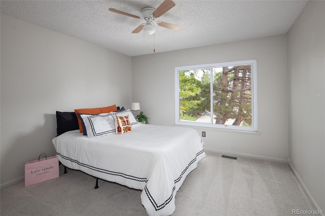 10572 E Orchard Pl, Englewood, CO 80111 - carpeted bedroom with a textured ceiling, baseboards, and a ceiling fan