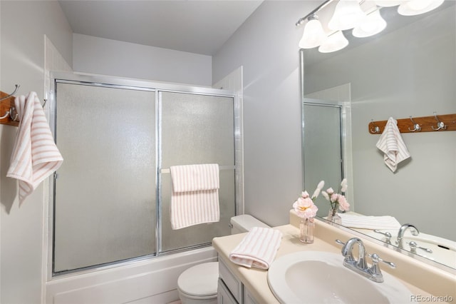 10572 E Orchard Pl, Englewood, CO 80111 - full bath featuring vanity, toilet, and bath / shower combo with glass door