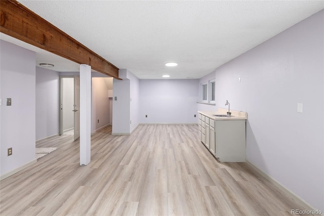 10572 E Orchard Pl, Englewood, CO 80111 - finished below grade area with a sink, light wood-style floors, baseboards, and recessed lighting
