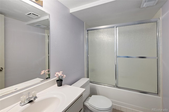 10572 E Orchard Pl, Englewood, CO 80111 - full bathroom with toilet, vanity, and enclosed tub / shower combo