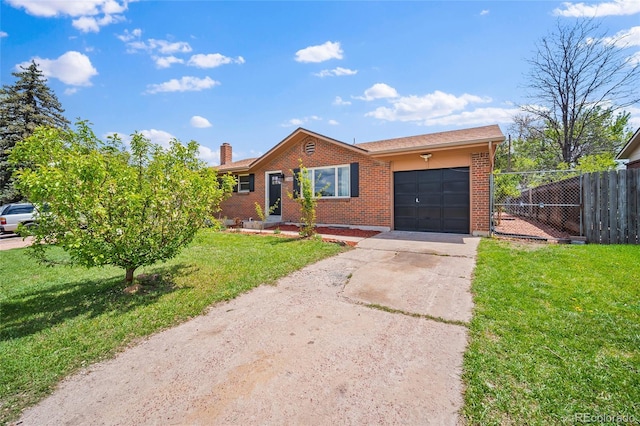 1607 Shasta Dr, Colorado Springs, CO 80910 - single story home featuring an attached garage, concrete driveway, brick siding, and a chimney