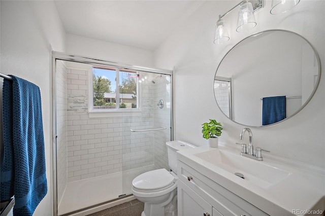 1607 Shasta Dr, Colorado Springs, CO 80910 - bathroom featuring a stall shower, toilet, vanity, and tile patterned flooring