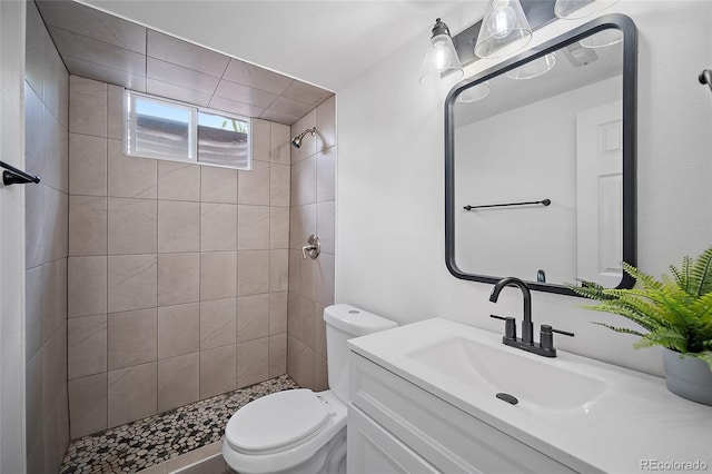 1607 Shasta Dr, Colorado Springs, CO 80910 - full bathroom featuring toilet, tiled shower, and vanity