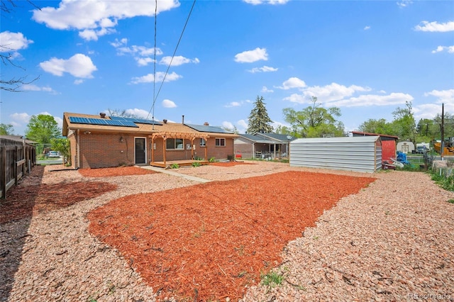 1607 Shasta Dr, Colorado Springs, CO 80910 - back of property with brick siding and solar panels
