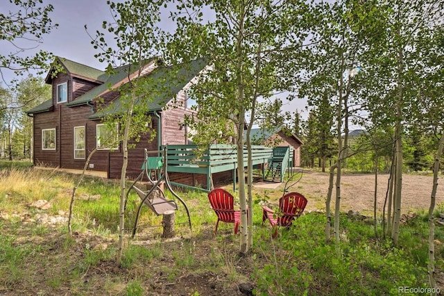 view of yard featuring a wooden deck