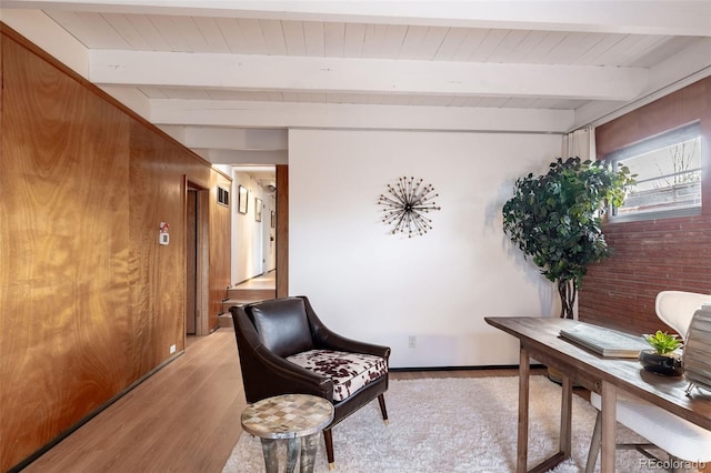 office space featuring light hardwood / wood-style flooring and beamed ceiling