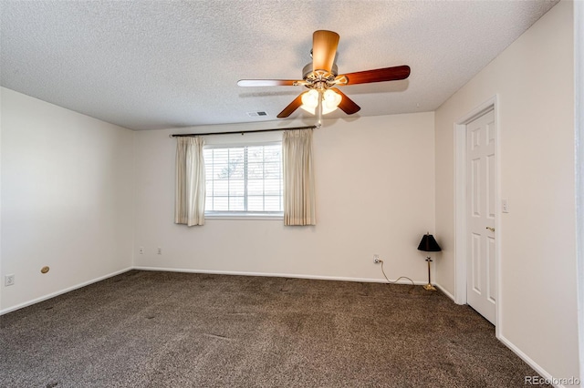 carpeted empty room featuring a textured ceiling and ceiling fan