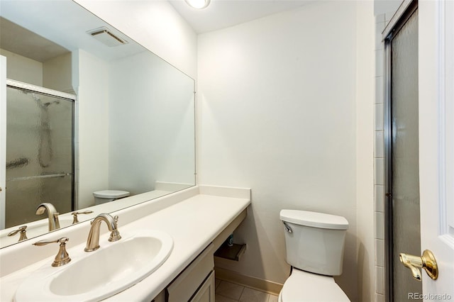 bathroom with toilet, a shower with door, tile patterned floors, and vanity