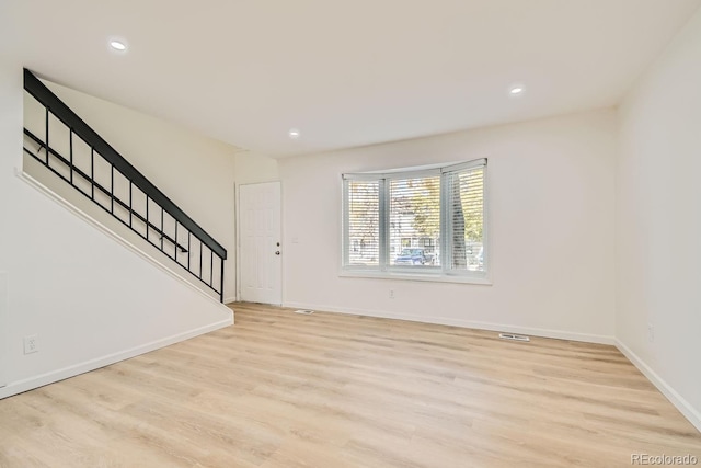 unfurnished living room featuring light hardwood / wood-style floors