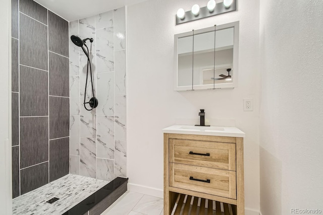 bathroom featuring vanity and a tile shower