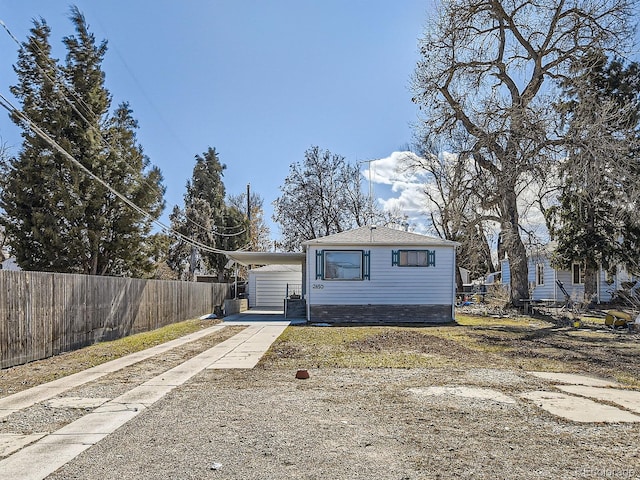 view of front of home featuring fence