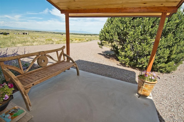 view of patio / terrace with a rural view