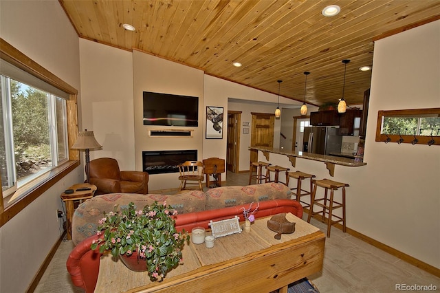 dining room featuring lofted ceiling and wood ceiling