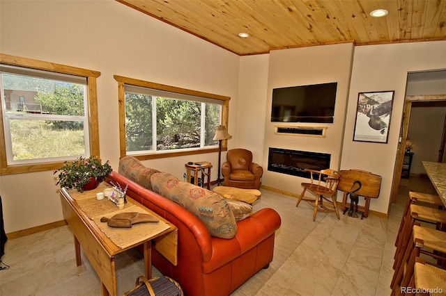 3421 Camino Del Rey, Crestone, CO 81131 - living area with wooden ceiling, recessed lighting, a glass covered fireplace, baseboards, and light marble finish flooring