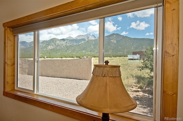 doorway to outside with plenty of natural light and a mountain view