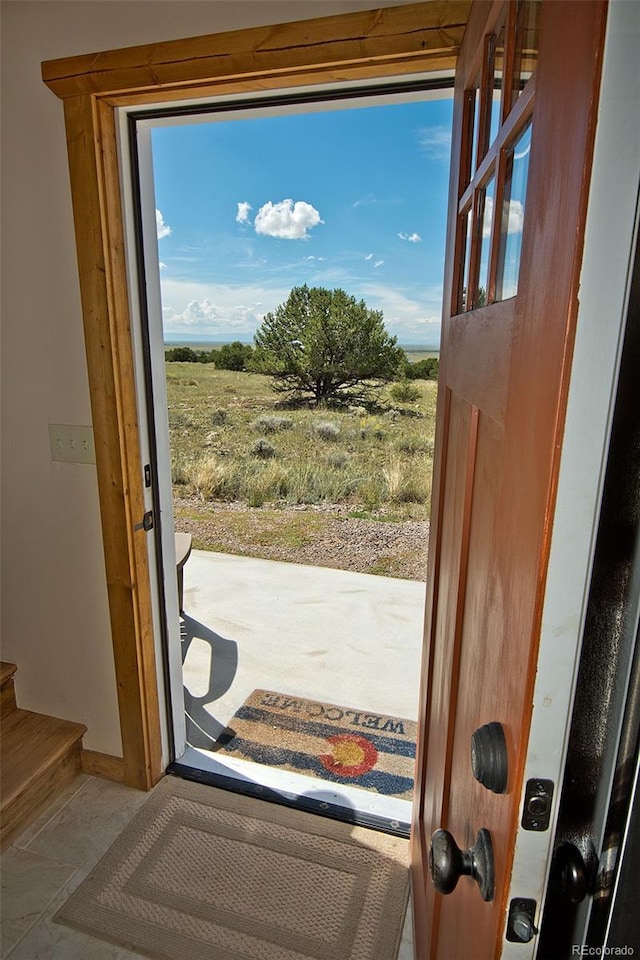 3421 Camino Del Rey, Crestone, CO 81131 - doorway to outside with stairs and baseboards
