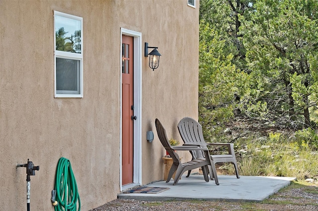 property entrance with a patio