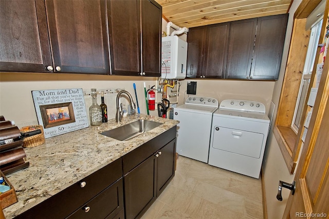 laundry room with cabinets, water heater, washing machine and dryer, sink, and wooden ceiling