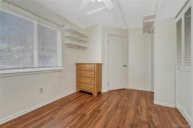 19140 E Milan Cir, Aurora, CO 80013 - unfurnished bedroom with a closet, baseboards, and wood finished floors