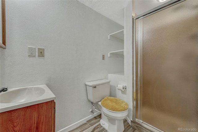 19140 E Milan Cir, Aurora, CO 80013 - full bathroom featuring toilet, baseboards, a shower stall, and vanity
