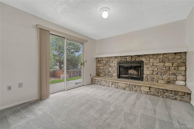 19140 E Milan Cir, Aurora, CO 80013 - unfurnished living room with baseboards, a textured ceiling, carpet, and a fireplace