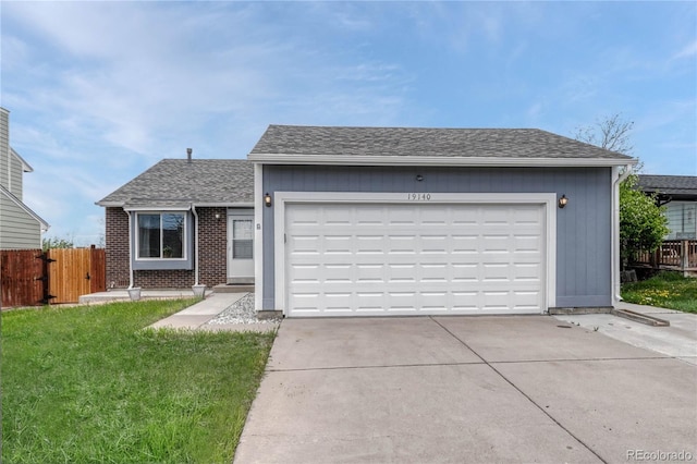19140 E Milan Cir, Aurora, CO 80013 - single story home with driveway, brick siding, fence, a garage, and a front lawn