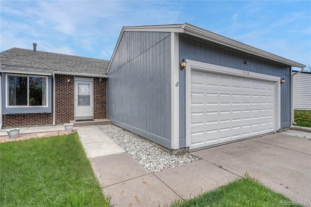 19140 E Milan Cir, Aurora, CO 80013 - view of front facade with a shingled roof, brick siding, and a garage
