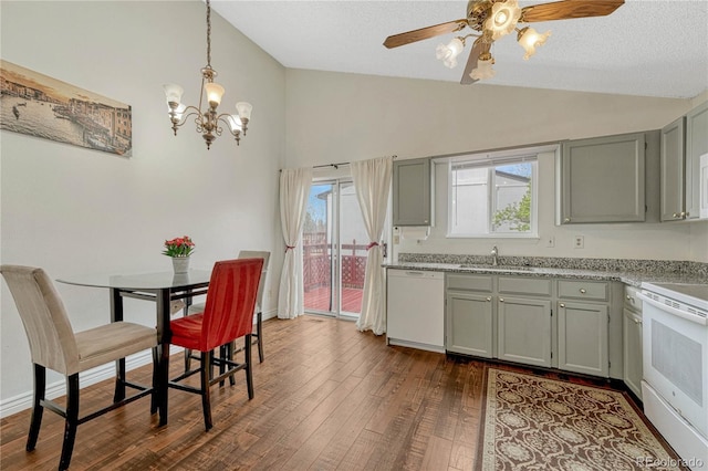 19140 E Milan Cir, Aurora, CO 80013 - kitchen with a sink, white appliances, ceiling fan with notable chandelier, vaulted ceiling, and dark wood-style flooring