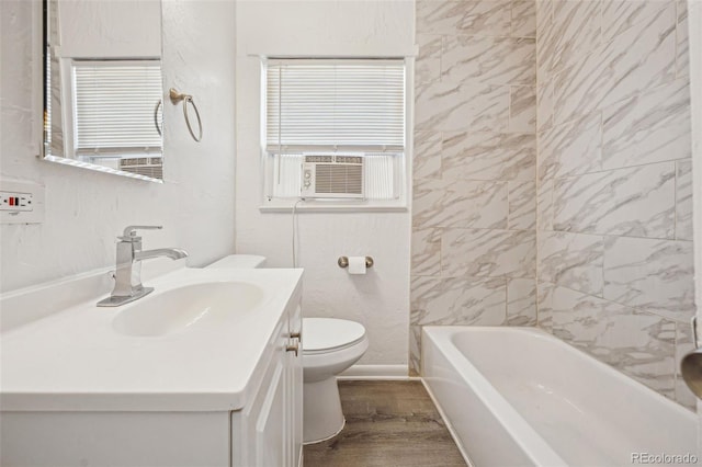 bathroom with hardwood / wood-style flooring, vanity, and toilet