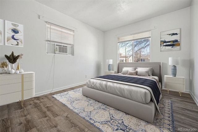 bedroom with cooling unit and hardwood / wood-style floors