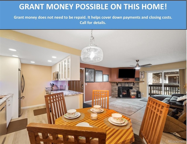 3482 S Eagle St Unit 102, Aurora, CO 80014 - dining room with ceiling fan, baseboards, recessed lighting, and a fireplace