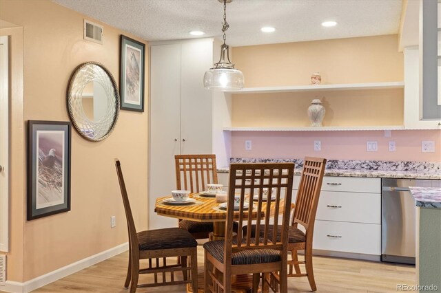3482 S Eagle St Unit 102, Aurora, CO 80014 - dining space with light wood-type flooring, recessed lighting, and baseboards