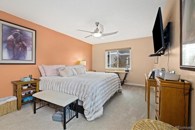 3482 S Eagle St Unit 102, Aurora, CO 80014 - bedroom featuring carpet, multiple windows, a ceiling fan, and baseboards