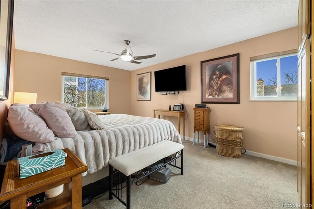 3482 S Eagle St Unit 102, Aurora, CO 80014 - carpeted bedroom featuring baseboards and a ceiling fan