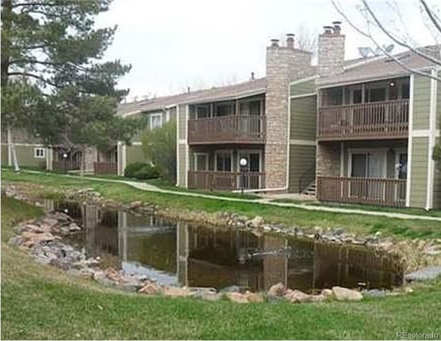 3482 S Eagle St Unit 102, Aurora, CO 80014 - back of house with a chimney