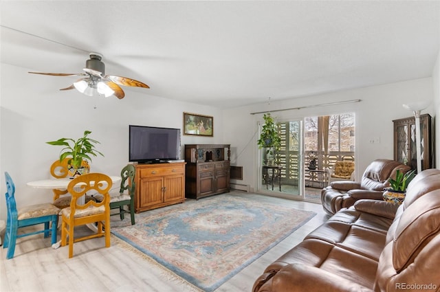 living room with a ceiling fan, light wood-style floors, and a baseboard radiator