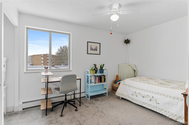carpeted bedroom with a baseboard heating unit