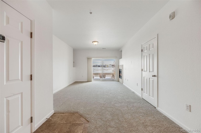 hallway featuring carpet flooring