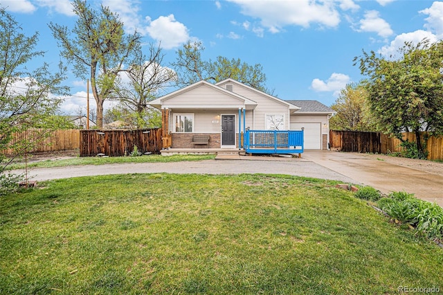 3065 W 80th Ave, Westminster, CO 80030 - view of front of property with driveway, covered porch, an attached garage, and brick siding