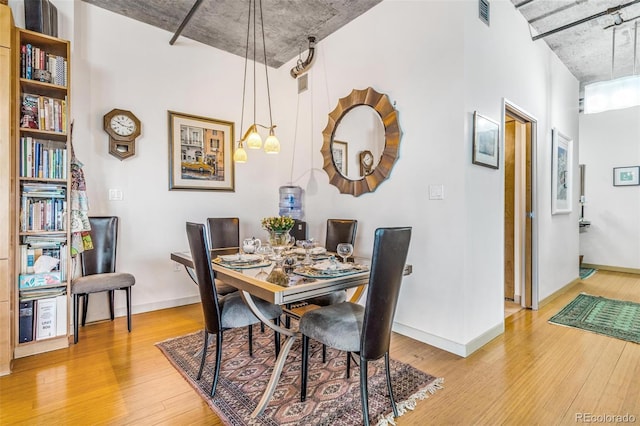1401 Wewatta St Unit 806, Denver, CO 80202 - dining area featuring light wood-type flooring and baseboards