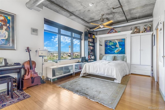 1401 Wewatta St Unit 806, Denver, CO 80202 - bedroom featuring wood finished floors