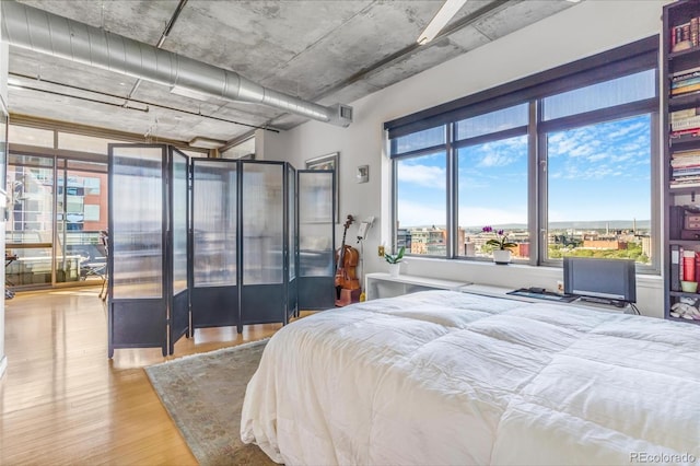 1401 Wewatta St Unit 806, Denver, CO 80202 - bedroom featuring wood finished floors