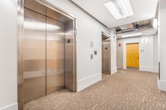 1401 Wewatta St Unit 806, Denver, CO 80202 - hallway featuring elevator and carpet