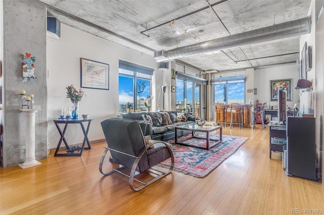 1401 Wewatta St Unit 806, Denver, CO 80202 - living room featuring light wood-type flooring