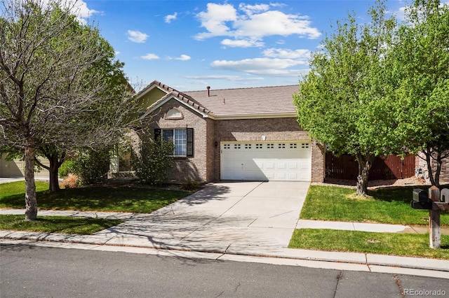 15594 E 97th Ave, Commerce City, CO 80022 - view of front of property with an attached garage, a front lawn, a tile roof, and concrete driveway