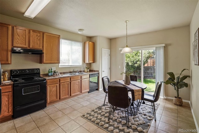15594 E 97th Ave, Commerce City, CO 80022 - kitchen featuring a sink, light tile patterned floors, black appliances, and under cabinet range hood