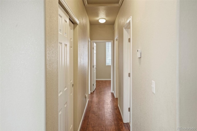 15594 E 97th Ave, Commerce City, CO 80022 - hall featuring baseboards, attic access, and dark wood-style flooring