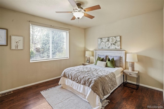 15594 E 97th Ave, Commerce City, CO 80022 - bedroom with baseboards, a ceiling fan, wood finished floors, and visible vents